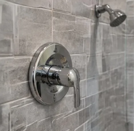 Water heater installed beside a South Florida home — Plan your plumbing. Explore financing