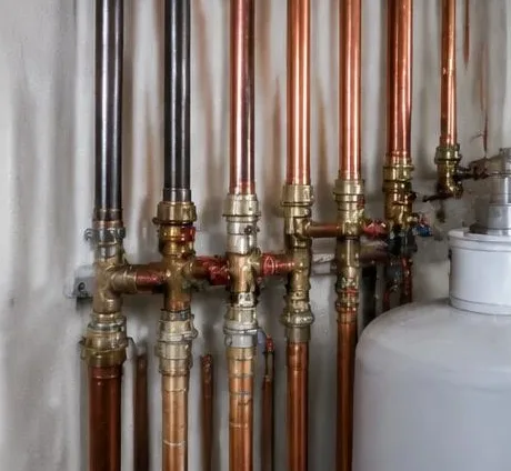 Water heater installed beside a South Florida home — Plumbing Maintenance in Boca Raton