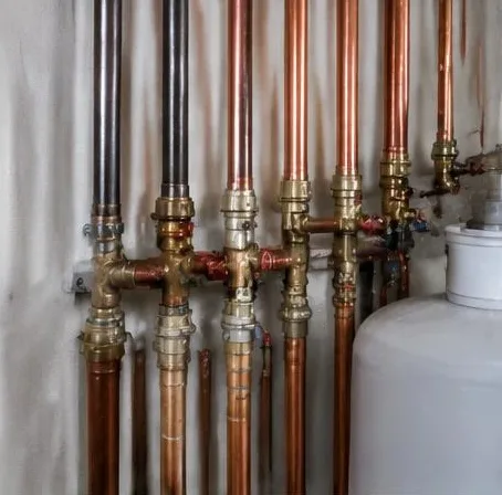 Water heater installed beside a South Florida home — Plumbing Replacement in West Palm Beach