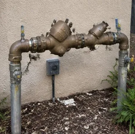 Water heater installed beside a South Florida home — Plumbing Replacement in Lake Worth Beach