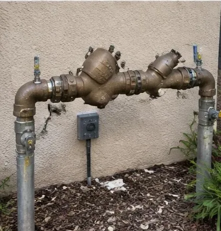 Water heater installed beside a South Florida home — Residential Plumbing in Loxahatchee